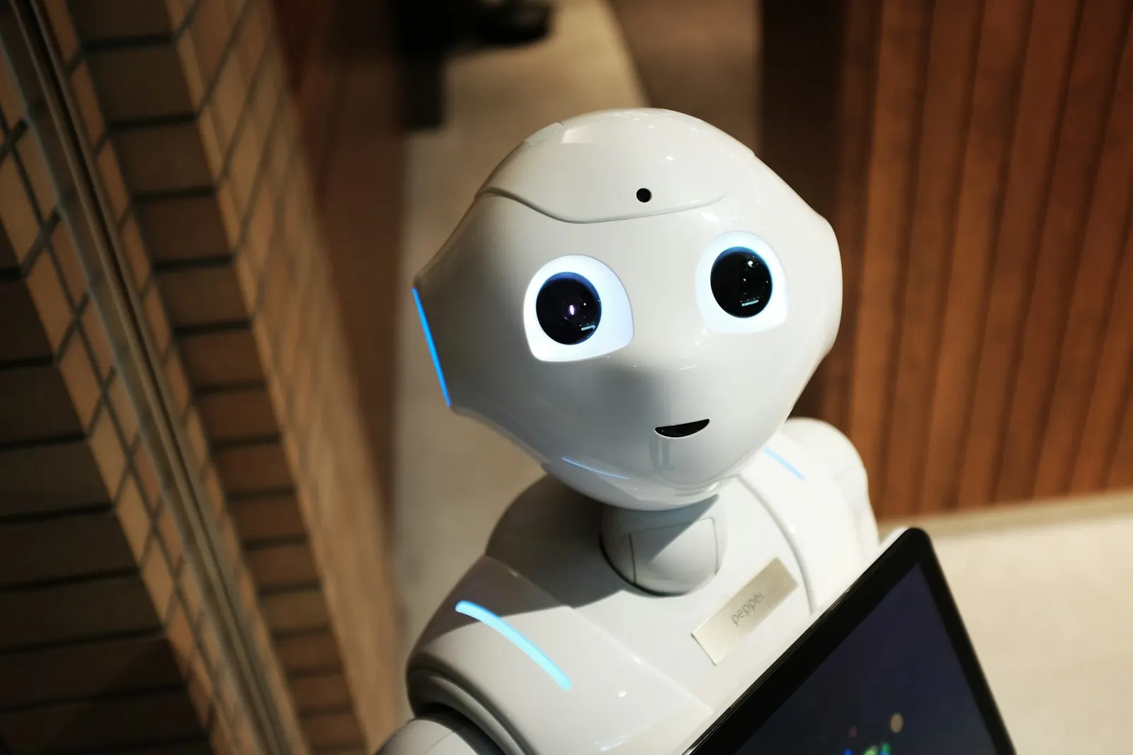 White robot hand reaching forward